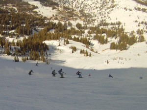 Skiers charging at Alpine Meadows.