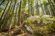 In the thick forest of Boulder Mountain outside of Revelstoke we found an amazing array of well built wood and rock features. Here Colin rolls a steep one.