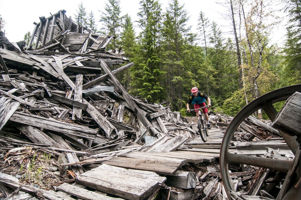 Ripping through what is left of an old mine above New Denver, BC on the Choices trail during a day of shuttling with Wandering Wheels bike tours.