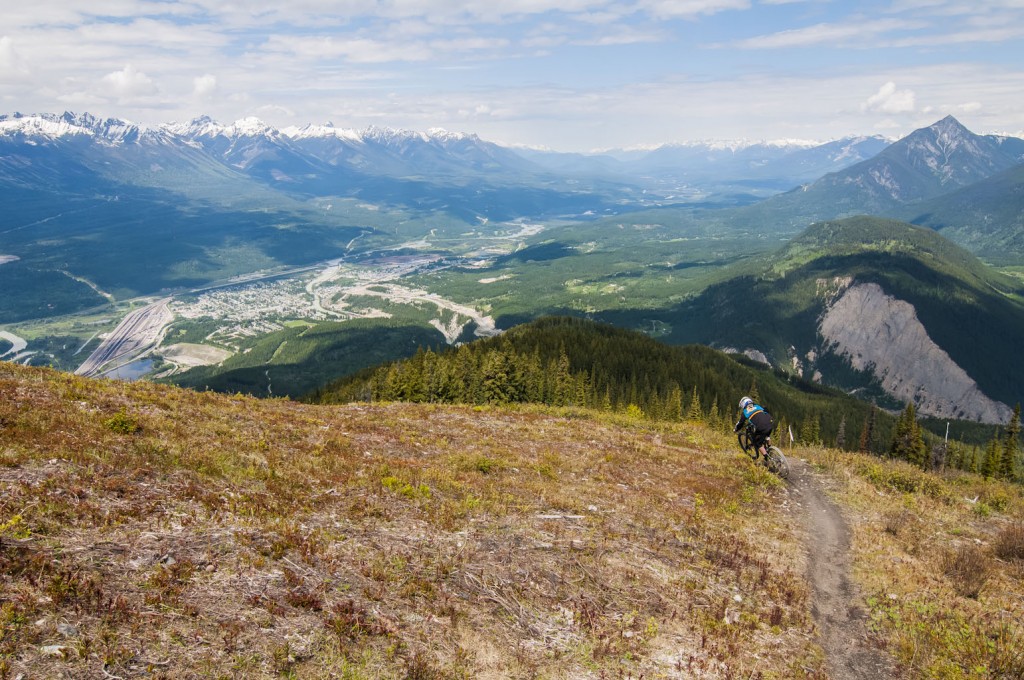 4,000 feet above downtown Golden, BC, Colin Pickett starts the steep and rowdy Red Wine trail off of Mt 7. 